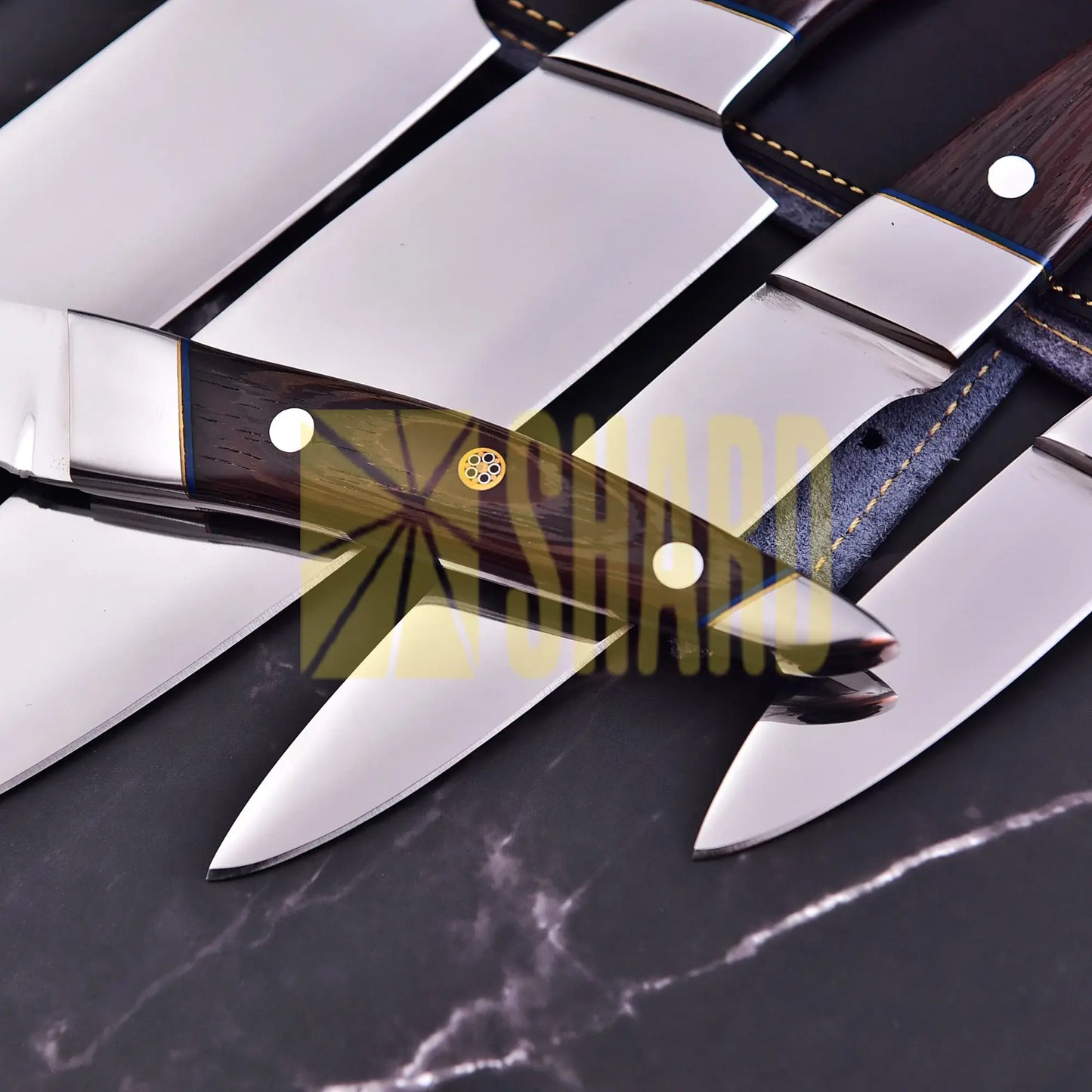 Handmade 5-piece chef set with clear steel finish, polished bolster, rosewood handles, and leather roll.