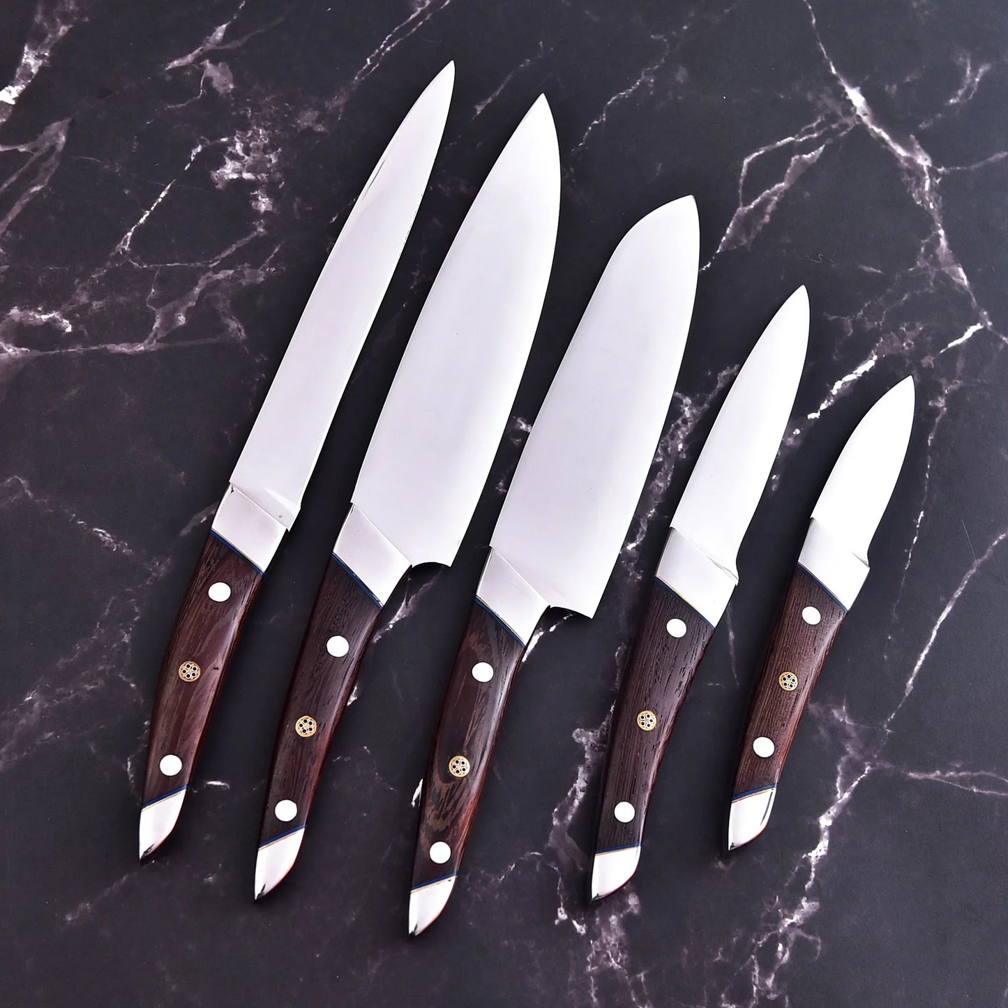 Handmade 5-piece chef set with clear steel finish, polished bolster, rosewood handles, and leather roll.