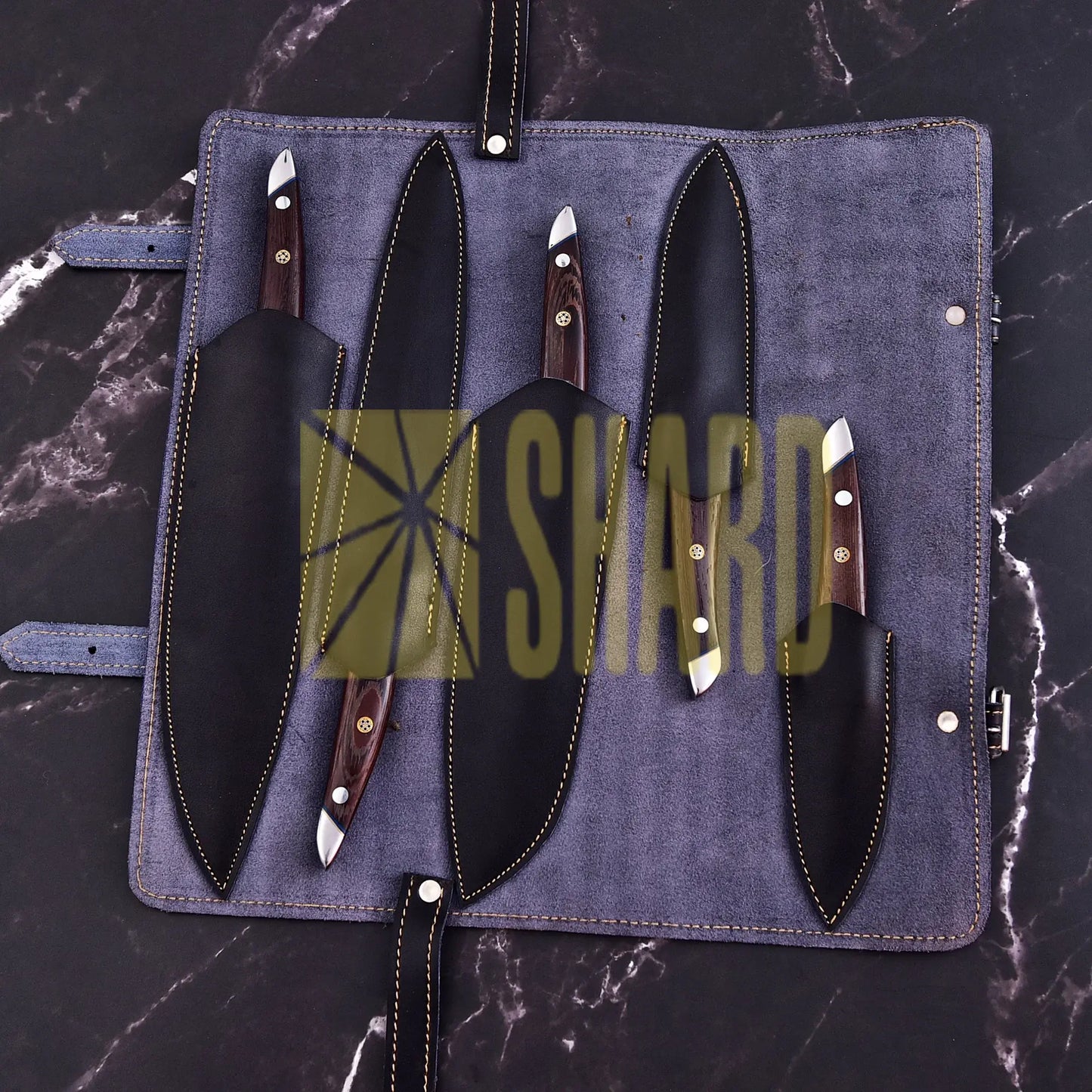 Handmade 5-piece chef set with clear steel finish, polished bolster, rosewood handles, and leather roll.