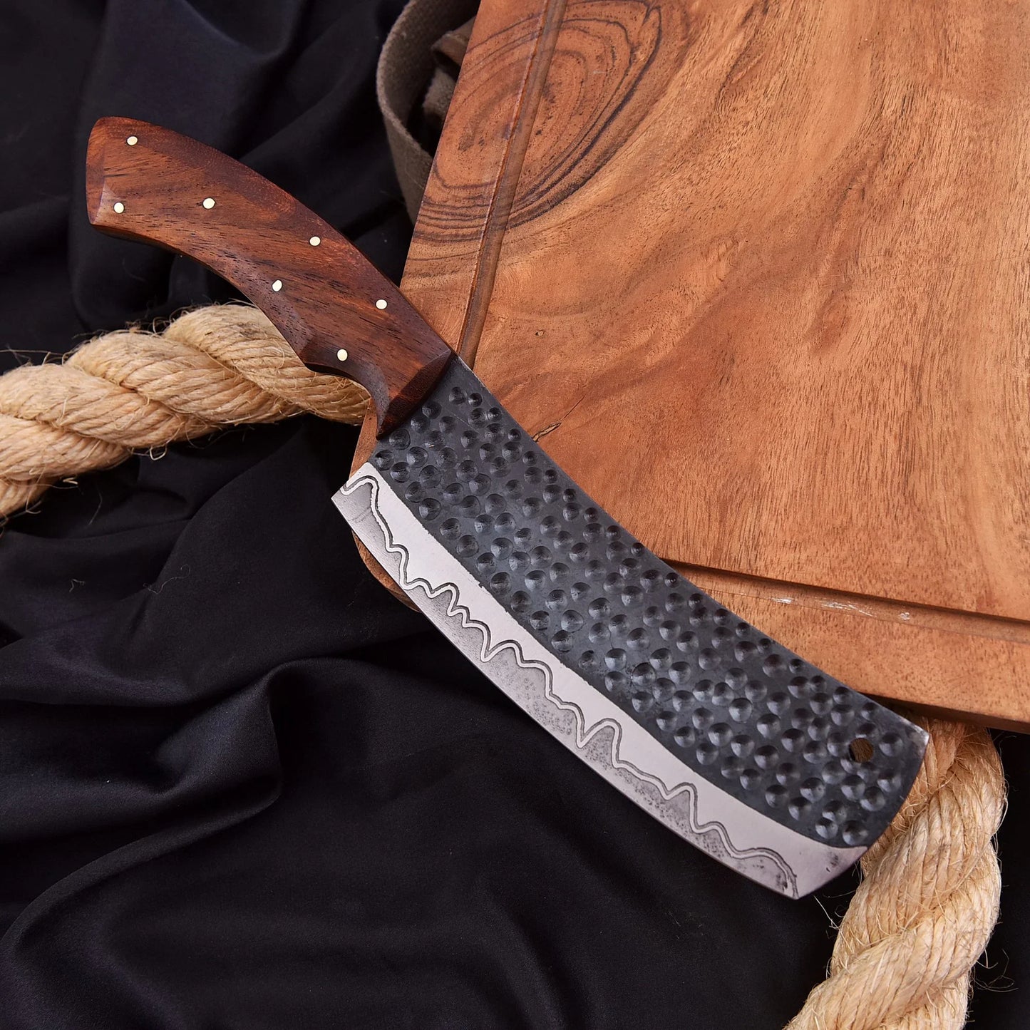 High-quality image of beautiful 1095 carbon steel hand forged clever chef kitchen knife with rose wood handle and leather carrying case