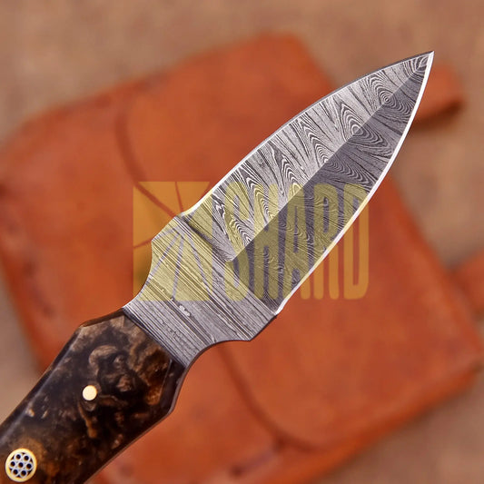 Hand-forged Damascus steel collectible with raindrop pattern and honey-colored resin handle – Raindrop Trail gift piece