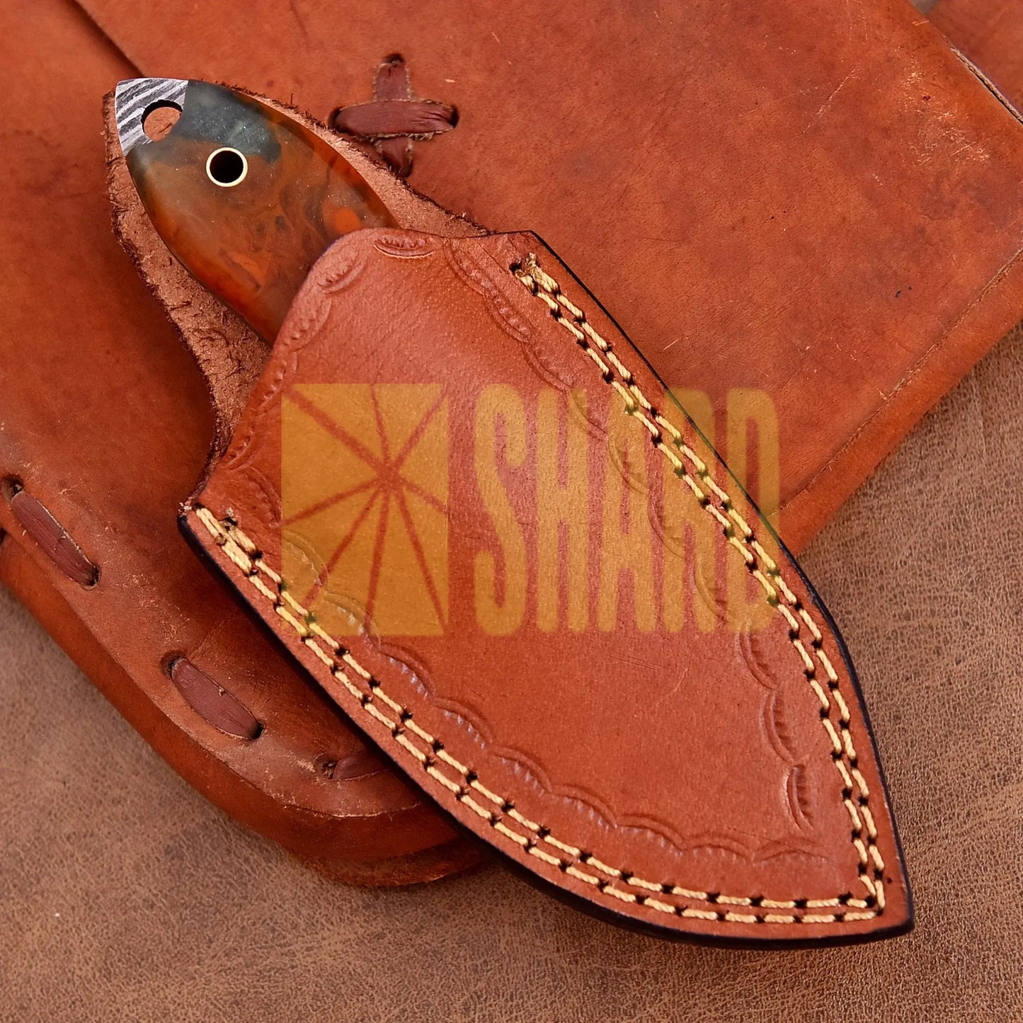 Hand-forged Damascus steel collectible with raindrop pattern and honey-colored resin handle – Raindrop Mini gift piece