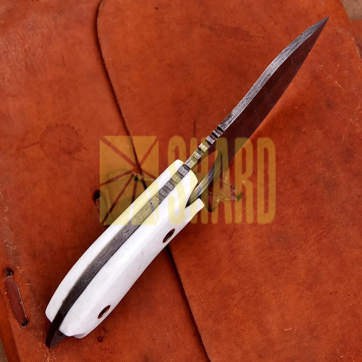 Hand-forged Damascus steel collectible with raindrop pattern and white resin handle – Raindrop Mini gift piece