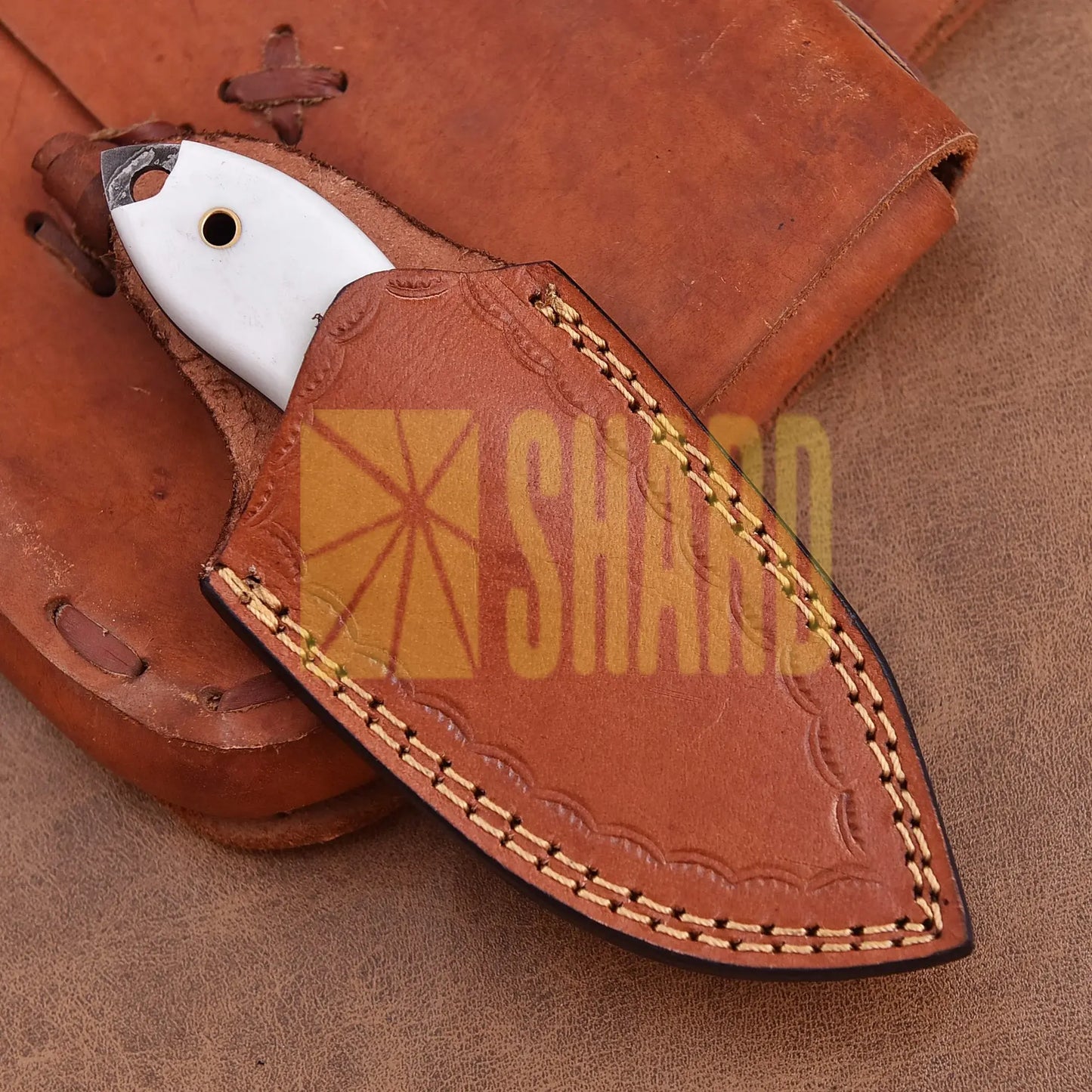 Hand-forged Damascus steel collectible with raindrop pattern and white resin handle – Raindrop Mini gift piece