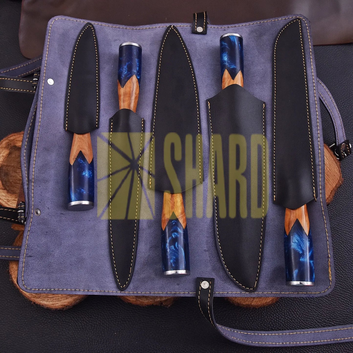 Handmade Oceanhearth Damascus Chef Set with natural wood and deep ocean resin handles – 5-piece collectible culinary set with leather roll.