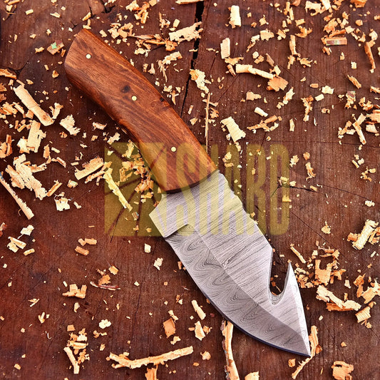 Hand-forged Damascus steel collectible with walnut wood handle and raindrop wave pattern.