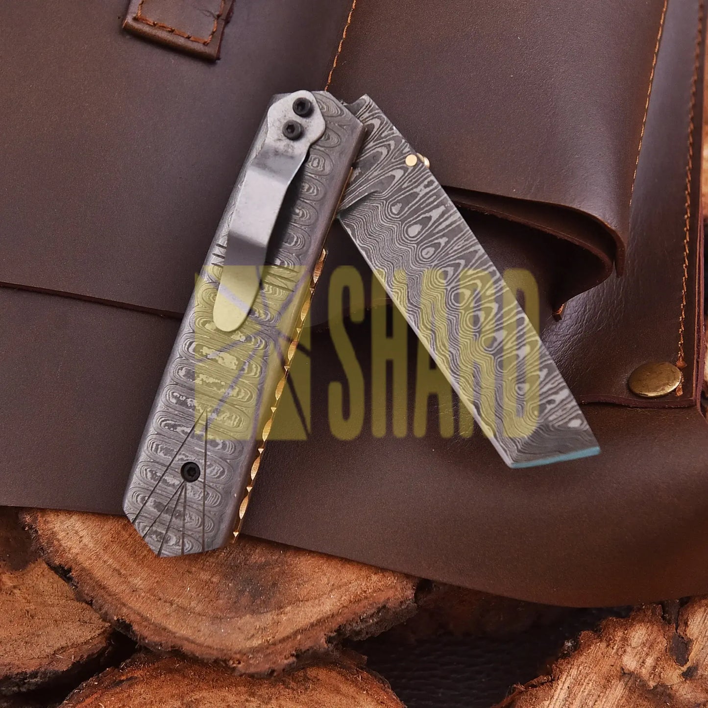 Crimson Crest Damascus Steel Folding Utility Craft with raindrop and wave pattern, featuring folding design and belt buckle clip.