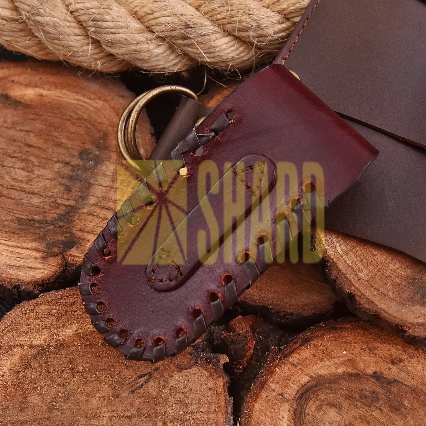 Crimson Crest Damascus Steel Folding Utility Craft with raindrop and wave pattern, featuring folding design and belt buckle clip.