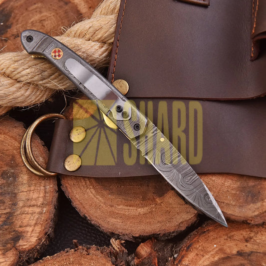 AuroraFold Damascus Collectible with raindrop pattern and folding design, handcrafted with artisan detail
