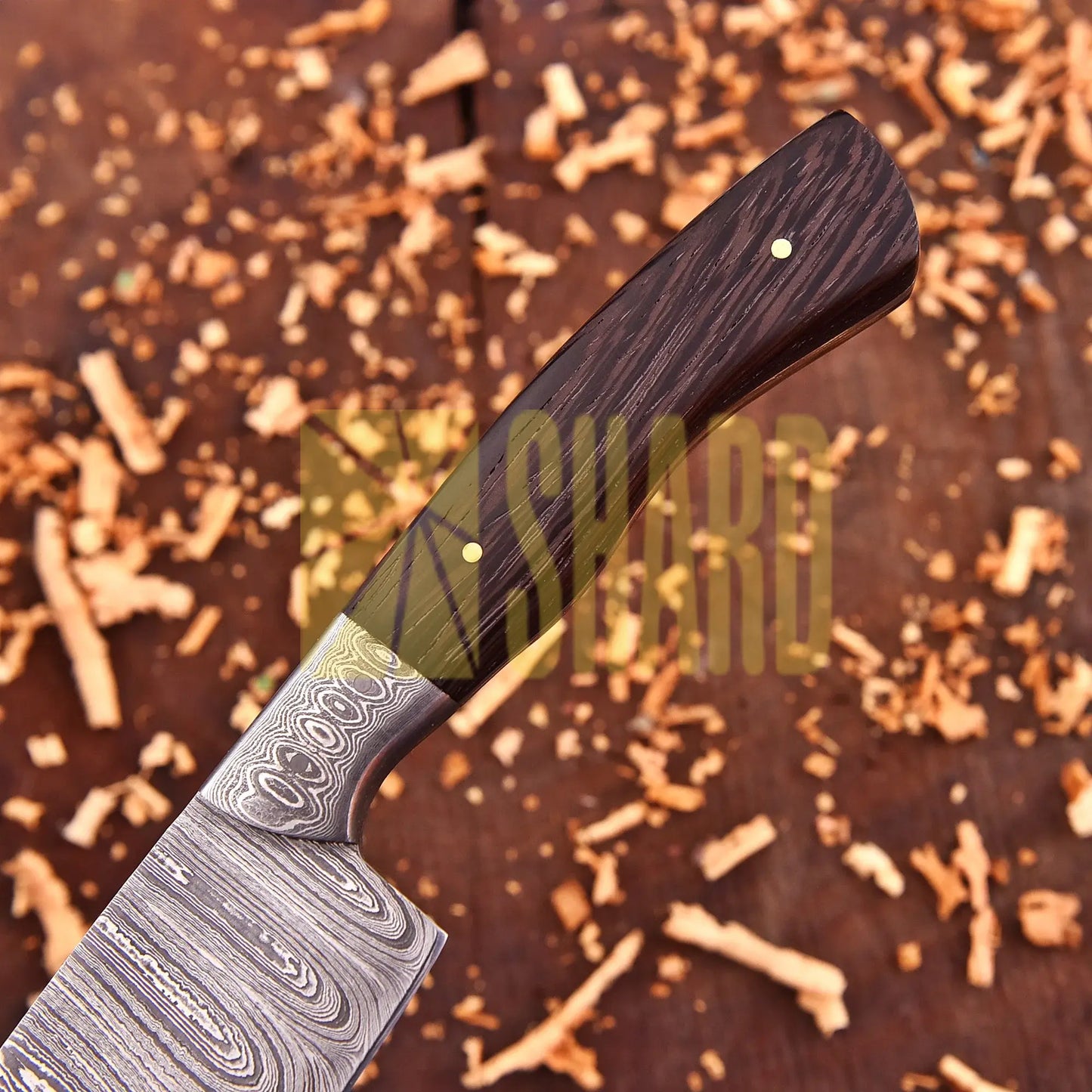 Hand-forged Damascus raindrop steel chef’s tool with rosewood handle – Emberleaf by Shard Blade