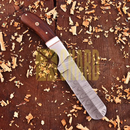 Hand-forged Damascus raindrop steel chef’s tool with steel bolster and Coralfin rosewood handle – Coralfin by Shard Blade