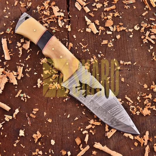 Lunar Howl Damascus collectible with wolf cut-out design and bone handle