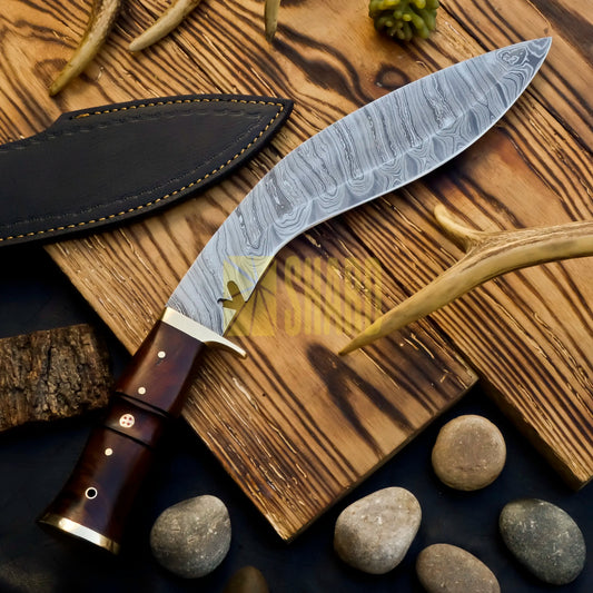 Hand-forged Damascus Kukri knife with polished rosewood handle โ Kingโs Valor 9-inch blade
