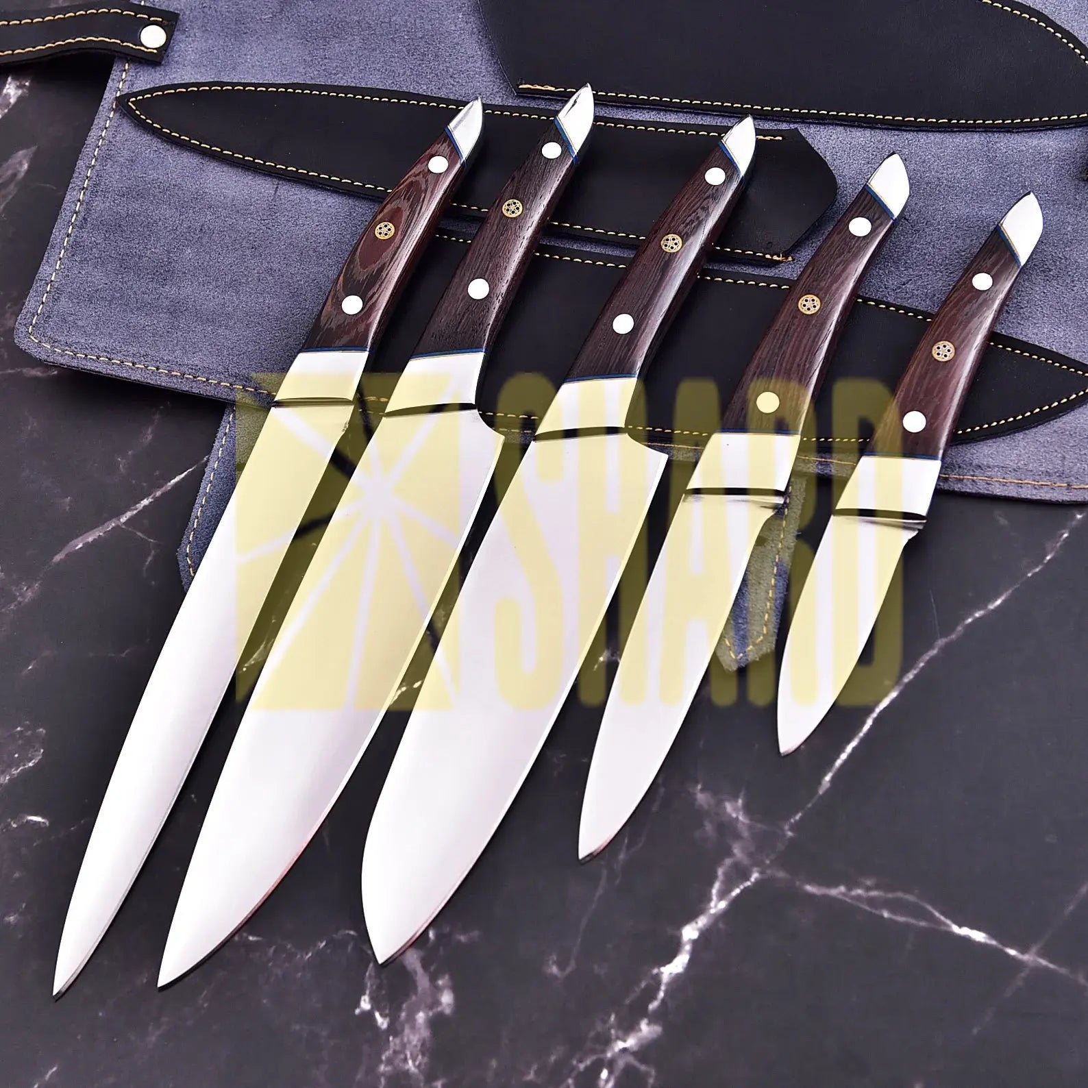 Handmade 5-piece chef set with clear steel finish, polished bolster, rosewood handles, and leather roll.