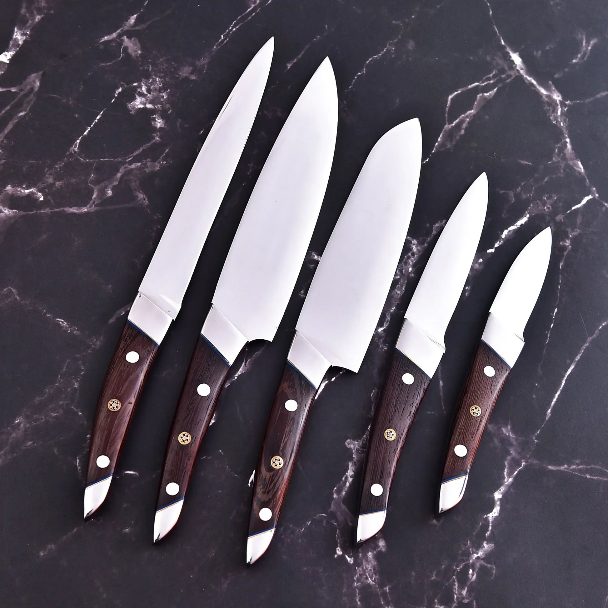 Handmade 5-piece chef set with clear steel finish, polished bolster, rosewood handles, and leather roll.