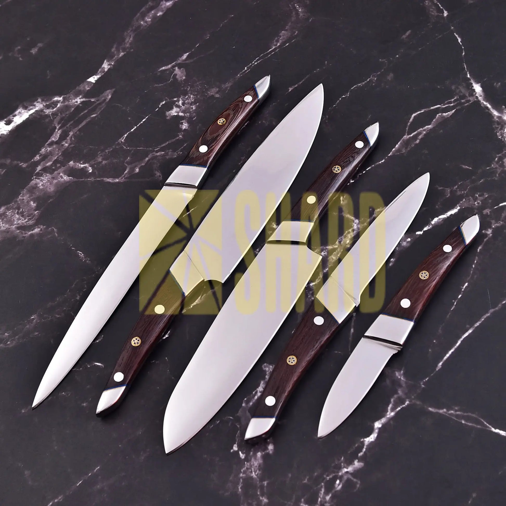 Handmade 5-piece chef set with clear steel finish, polished bolster, rosewood handles, and leather roll.