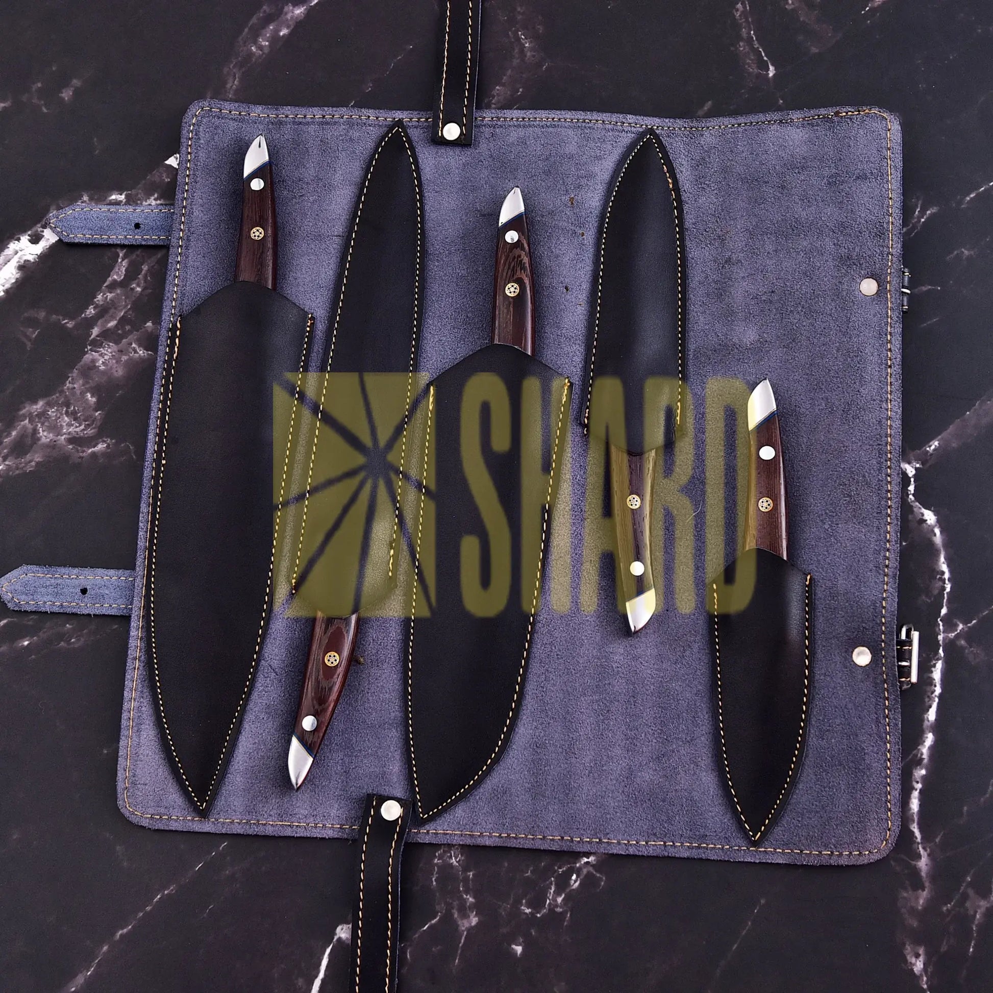 Handmade 5-piece chef set with clear steel finish, polished bolster, rosewood handles, and leather roll.