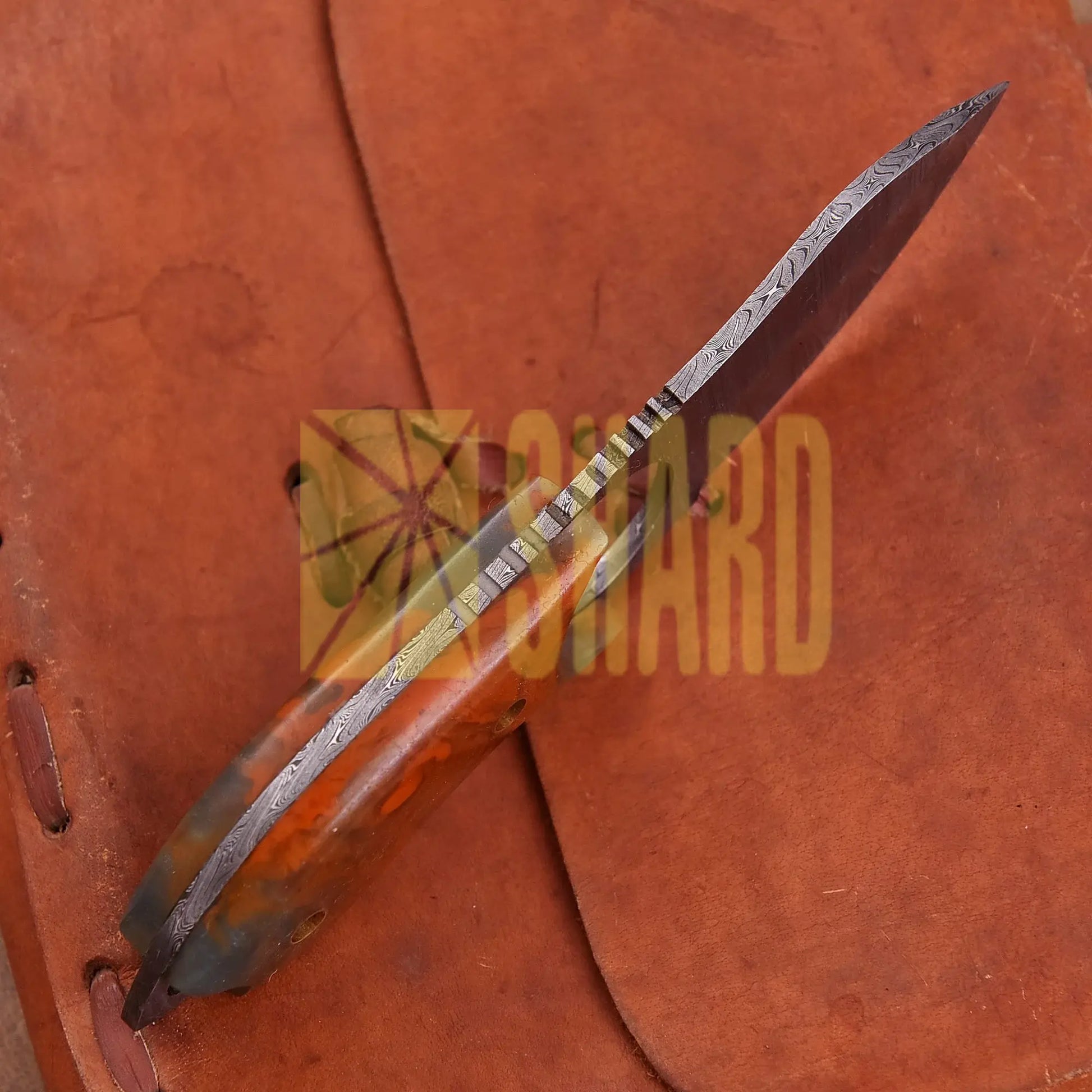 Hand-forged Damascus steel collectible with raindrop pattern and honey-colored resin handle – Raindrop Mini gift piece