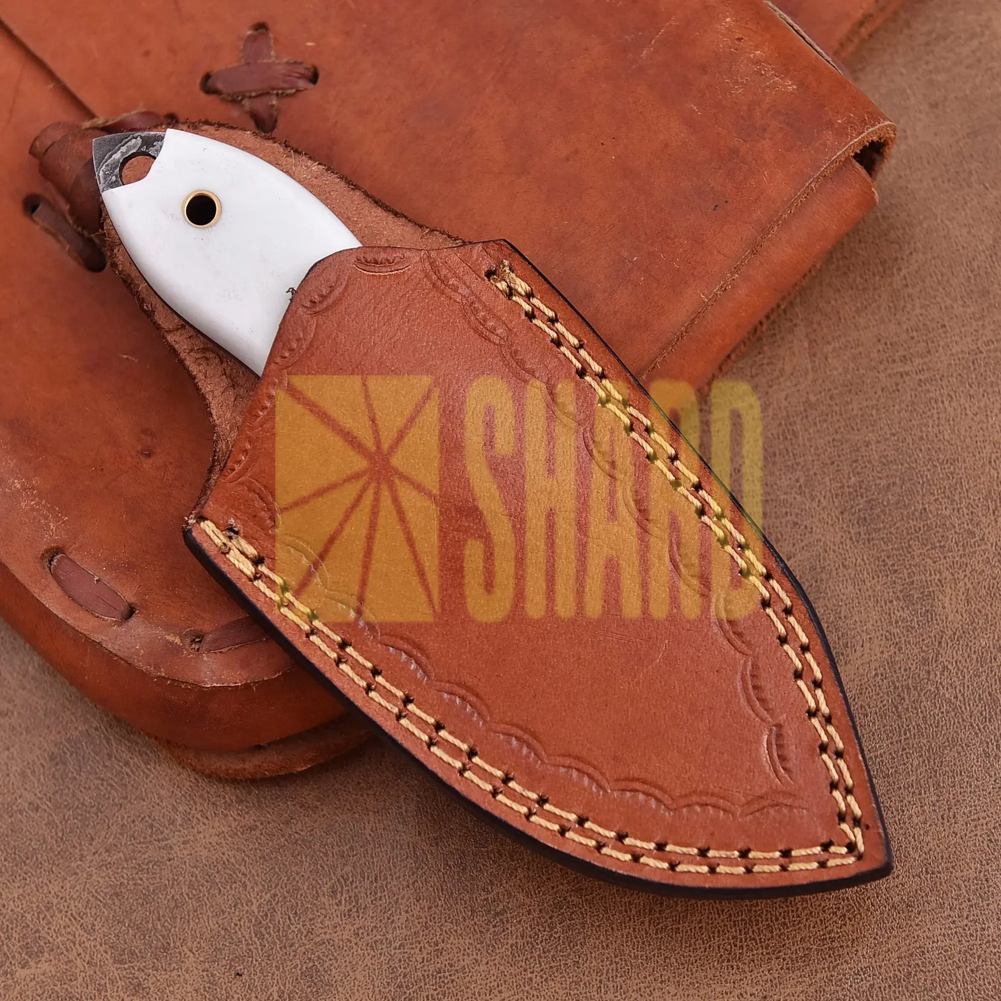 Hand-forged Damascus steel collectible with raindrop pattern and white resin handle – Raindrop Mini gift piece