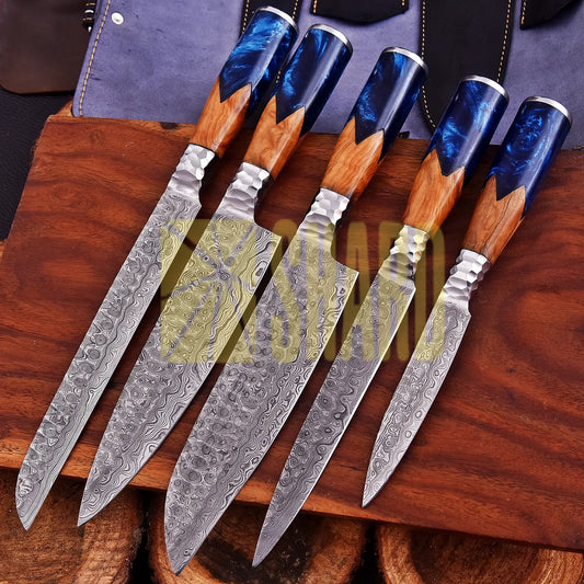 Handmade Oceanhearth Damascus Chef Set with natural wood and deep ocean resin handles – 5-piece collectible culinary set with leather roll.