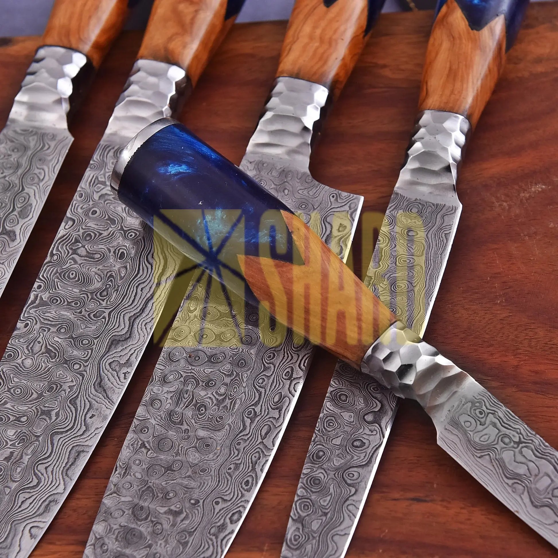 Handmade Oceanhearth Damascus Chef Set with natural wood and deep ocean resin handles – 5-piece collectible culinary set with leather roll.