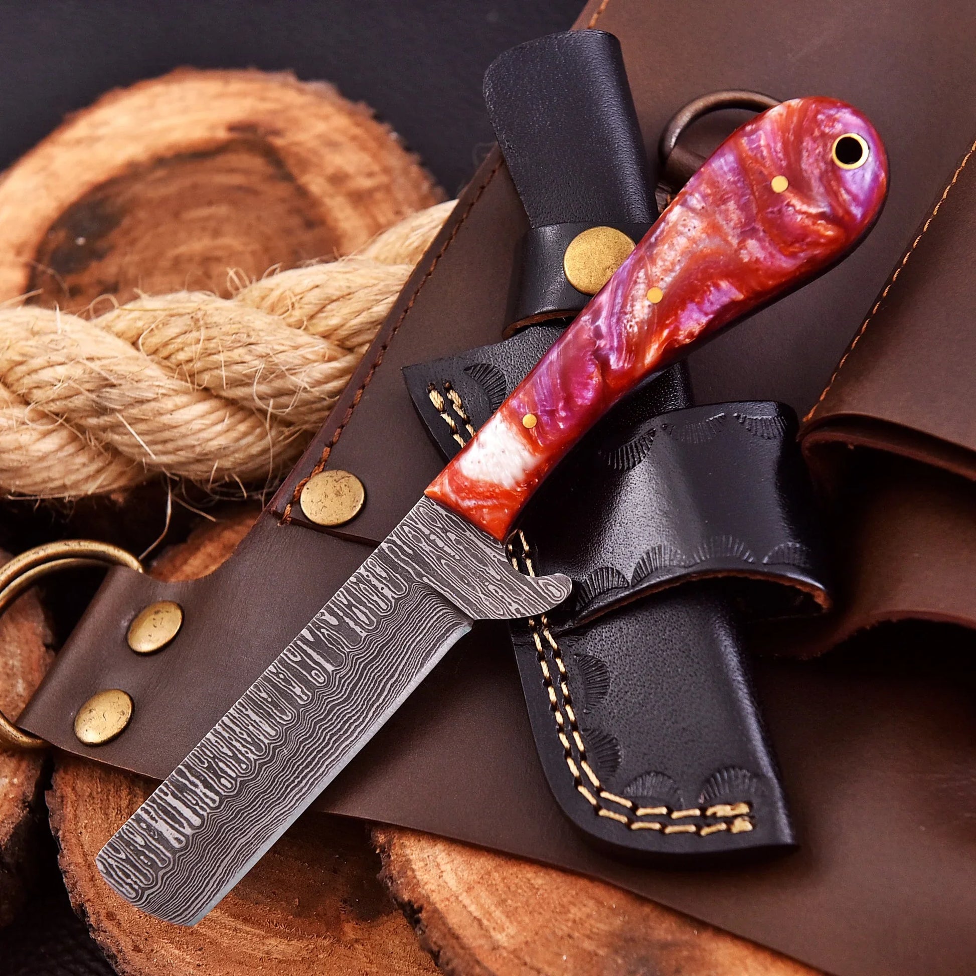 Handcrafted Riverstone Guppy kitchen collectible with Damascus raindrop pattern and stone resin handle