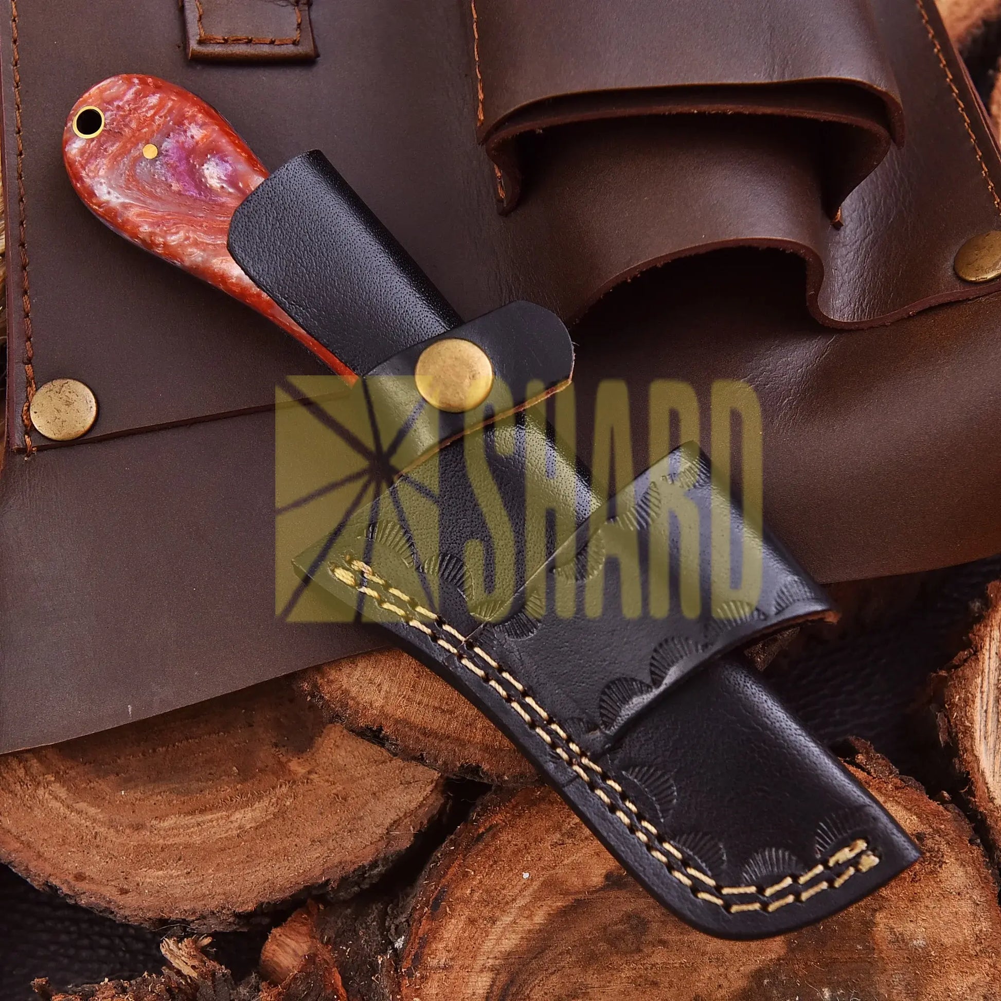 Handcrafted Riverstone Guppy kitchen collectible with Damascus raindrop pattern and stone resin handle
