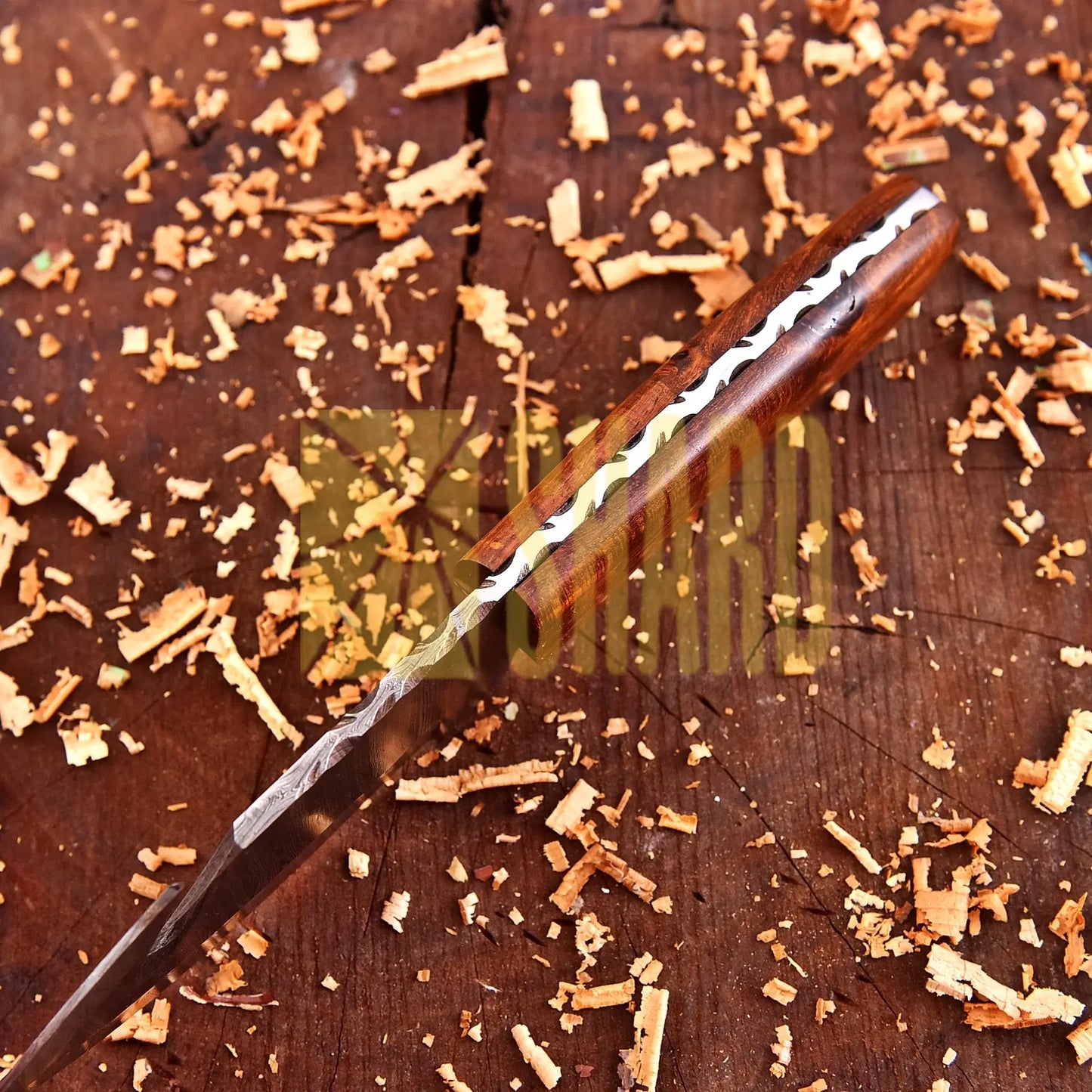 Hand-forged Damascus steel collectible with walnut wood handle and raindrop wave pattern.
