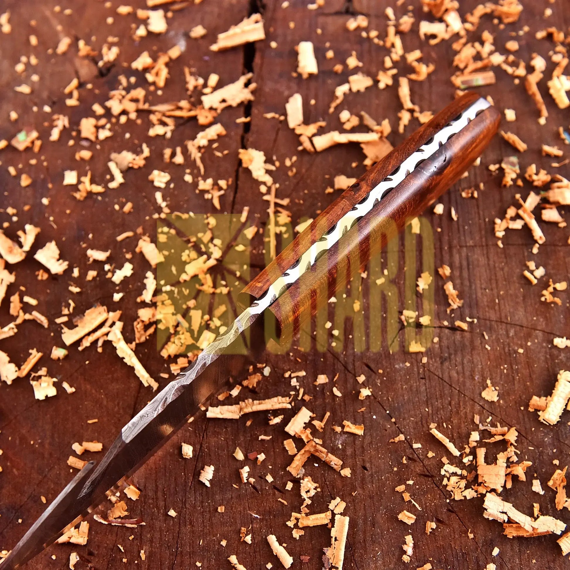 Hand-forged Damascus steel collectible with walnut wood handle and raindrop wave pattern.