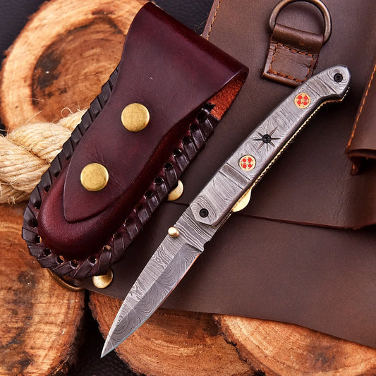 AuroraFold Damascus Collectible with raindrop pattern and folding design, handcrafted with artisan detail