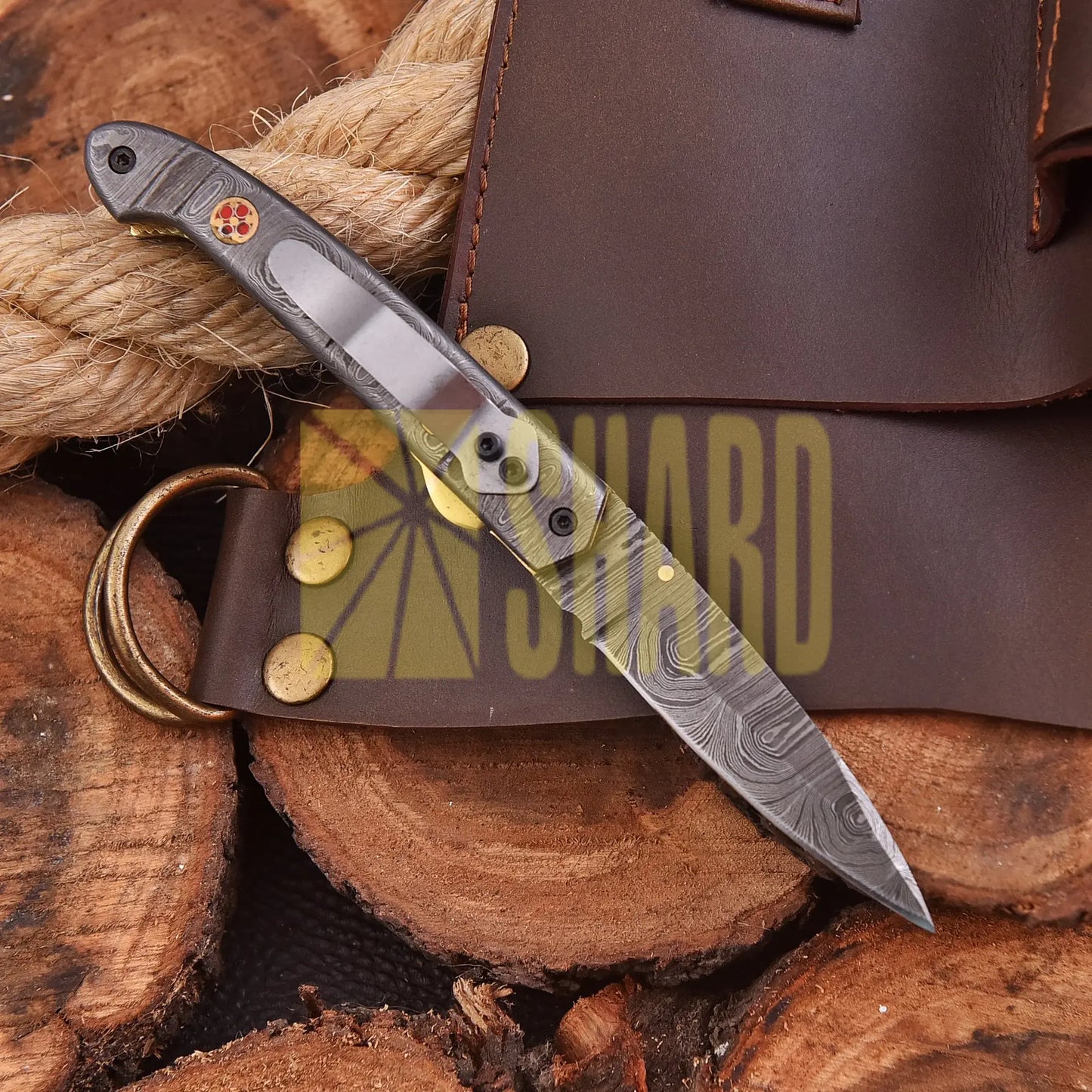 AuroraFold Damascus Collectible with raindrop pattern and folding design, handcrafted with artisan detail