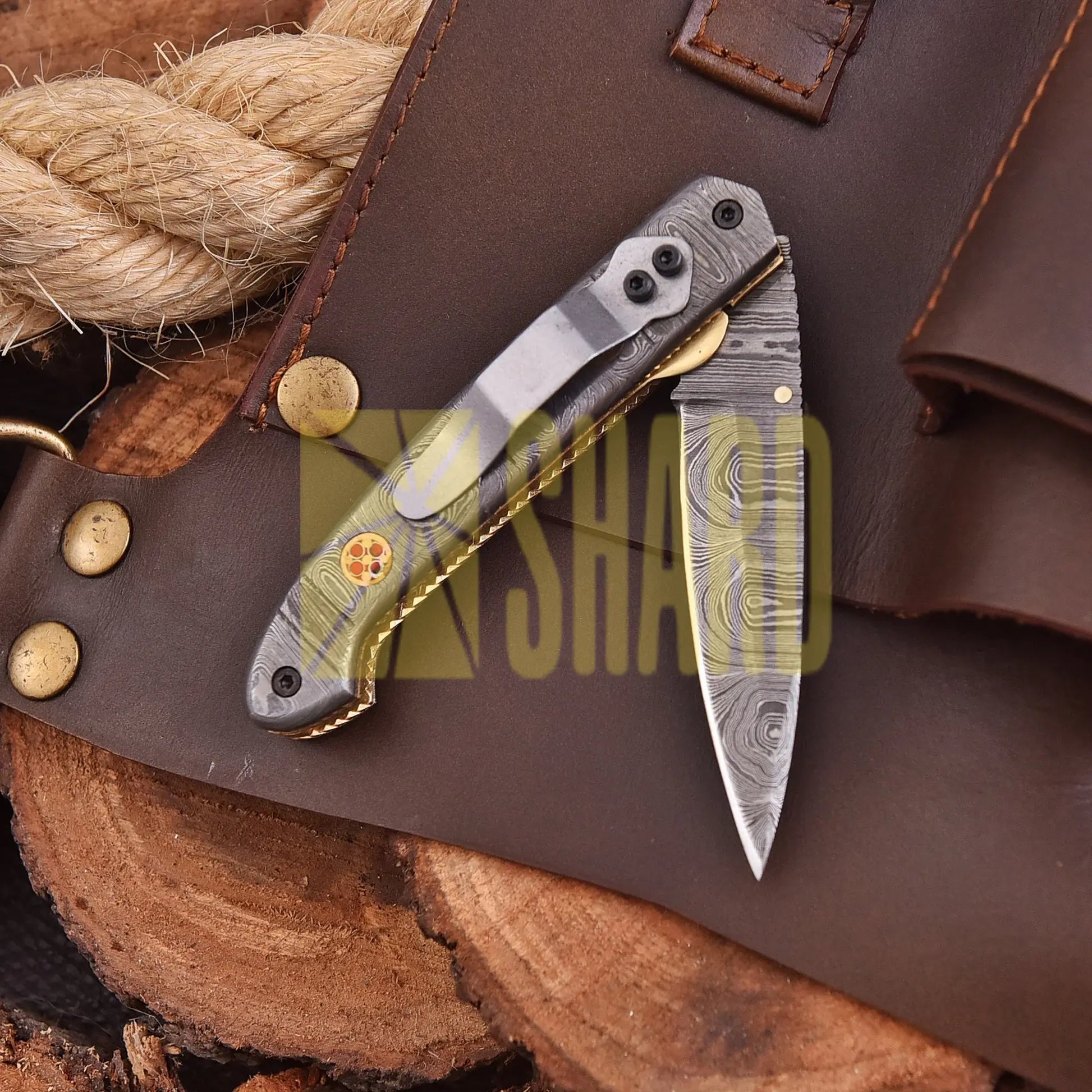 AuroraFold Damascus Collectible with raindrop pattern and folding design, handcrafted with artisan detail