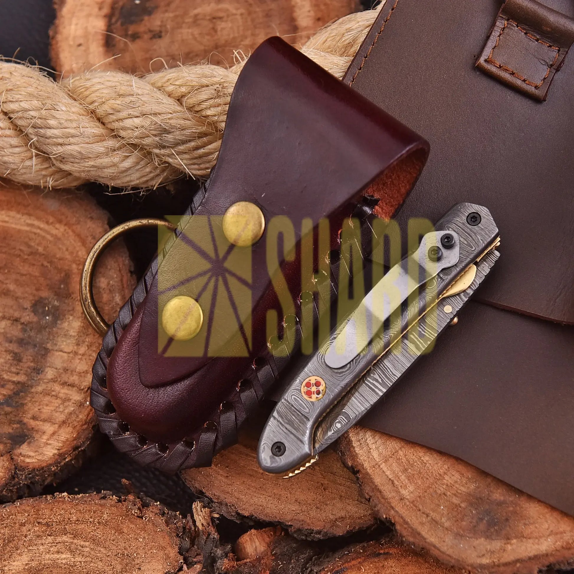 AuroraFold Damascus Collectible with raindrop pattern and folding design, handcrafted with artisan detail