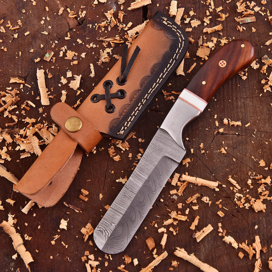 Hand-forged Damascus raindrop steel chef’s tool with steel bolster and Coralfin rosewood handle – Coralfin by Shard Blade