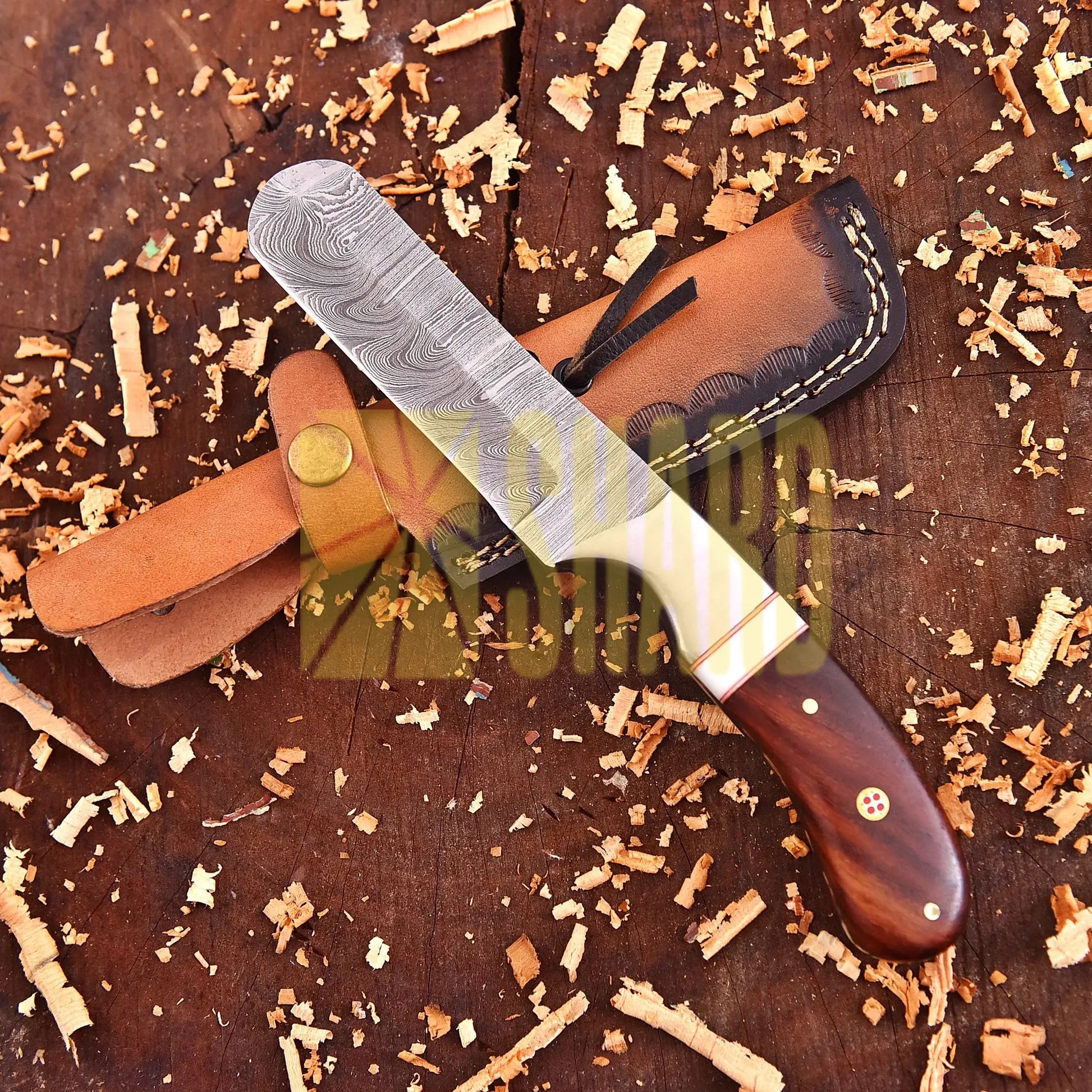 Hand-forged Damascus raindrop steel chef’s tool with steel bolster and Coralfin rosewood handle – Coralfin by Shard Blade