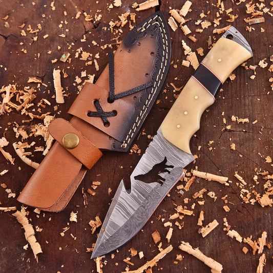 Lunar Howl Damascus collectible with wolf cut-out design and bone handle