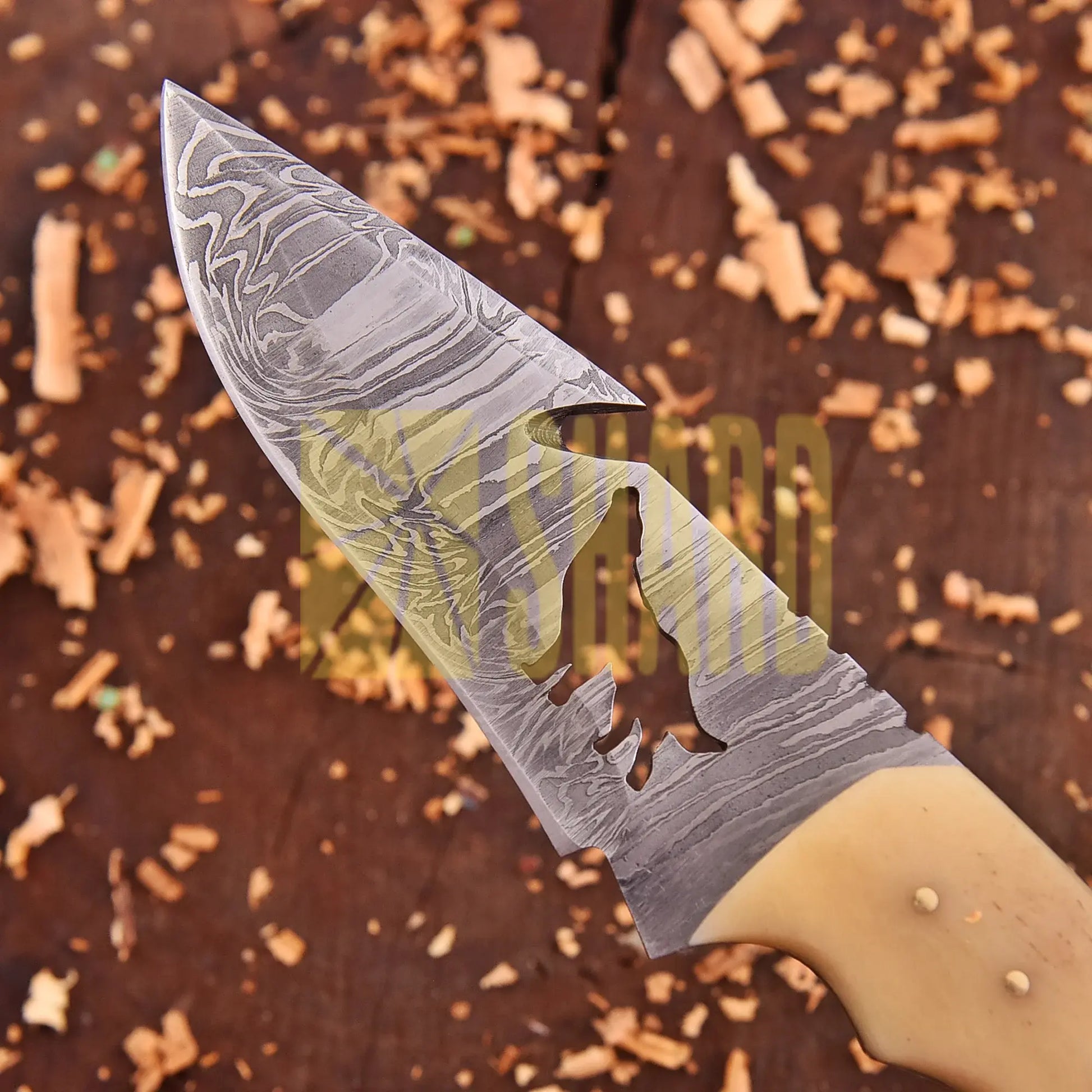 Lunar Howl Damascus collectible with wolf cut-out design and bone handle